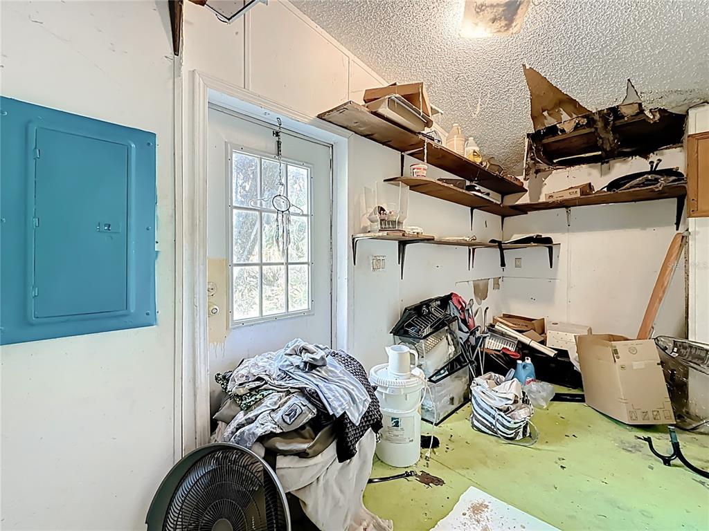 2414 Brock Road Plant City, FL 33565 - Photo 29 of 63 a bed sitting in a bedroom next to a window