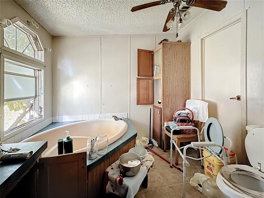 2414 Brock Road Plant City, FL 33565 - Photo 31 of 63 a bath room with a bed furniture and a window