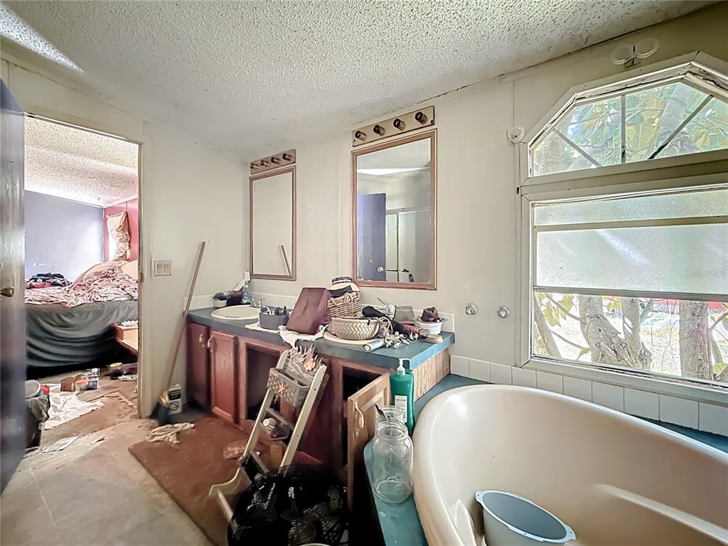 2414 Brock Road Plant City, FL 33565 - Photo 33 of 63 a room with furniture a flat screen tv and a large window