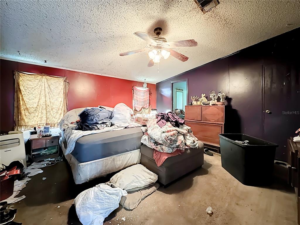 2414 Brock Road Plant City, FL 33565 - Photo 35 of 63 a living room with furniture and a flat screen tv