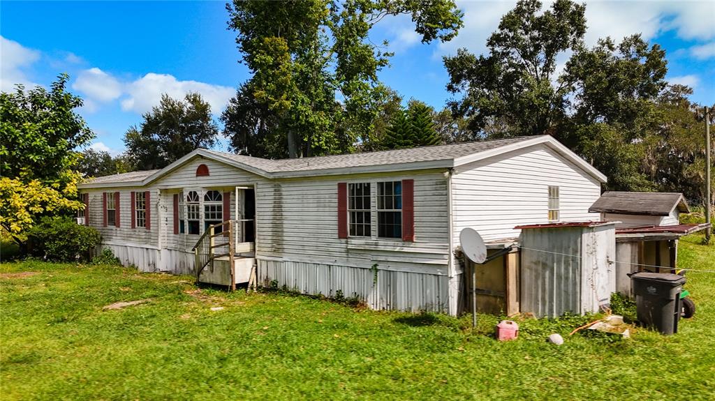 2414 Brock Road Plant City, FL 33565 - Photo 4 of 63 a front view of house with yard and green space