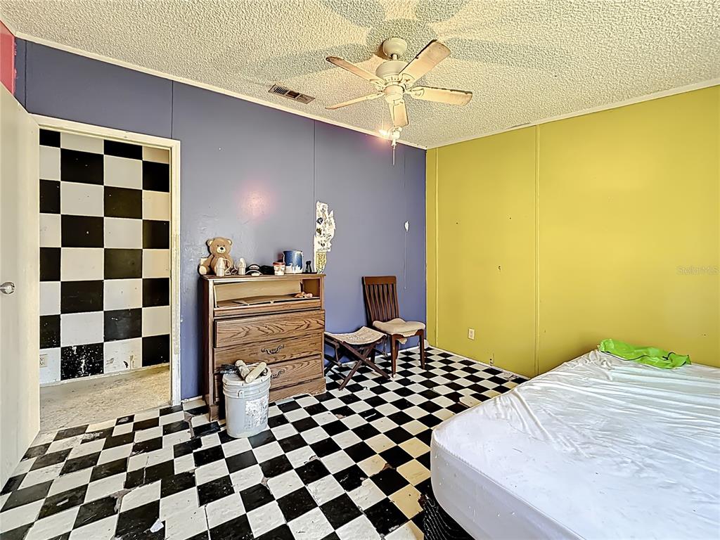 2414 Brock Road Plant City, FL 33565 - Photo 43 of 63 a bedroom with a bed and a window