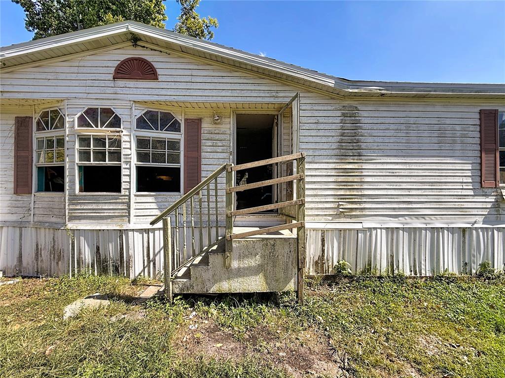 2414 Brock Road Plant City, FL 33565 - Photo 50 of 63 a front view of a house with a yard