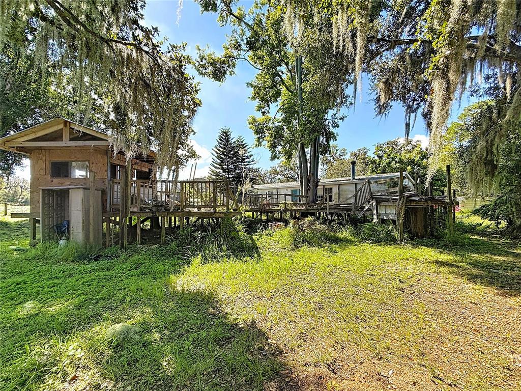 2414 Brock Road Plant City, FL 33565 - Photo 56 of 63 a view of a house with a yard