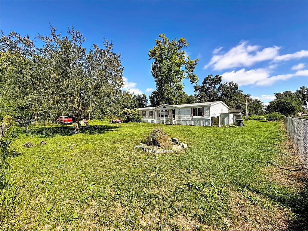 2414 Brock Road Plant City, FL 33565 - Photo 9 of 63 a house view with a garden space