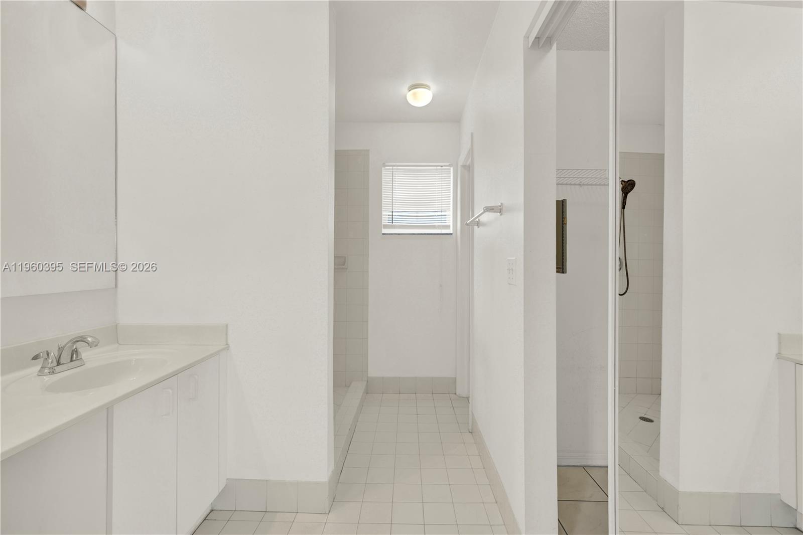 11321 Southwest 62nd Lane Miami, FL 33173 - Photo 17 of 43 a bathroom with a sink and a mirror