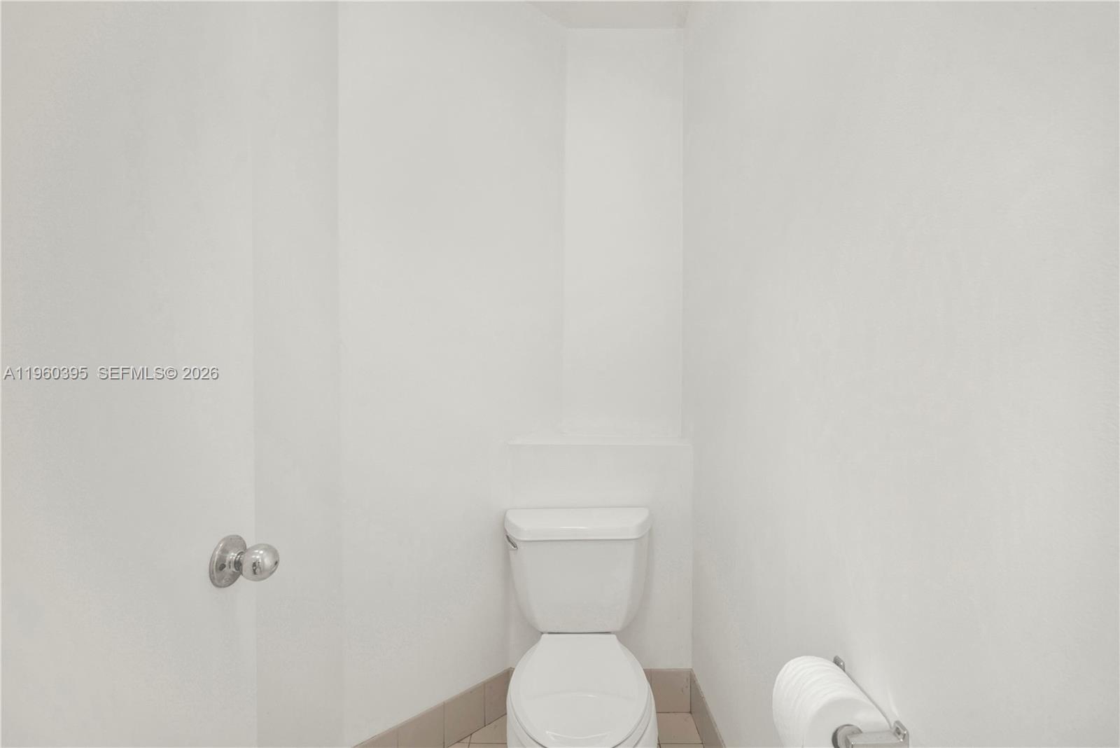 11321 Southwest 62nd Lane Miami, FL 33173 - Photo 20 of 43 a white toilet sitting next to a white wall