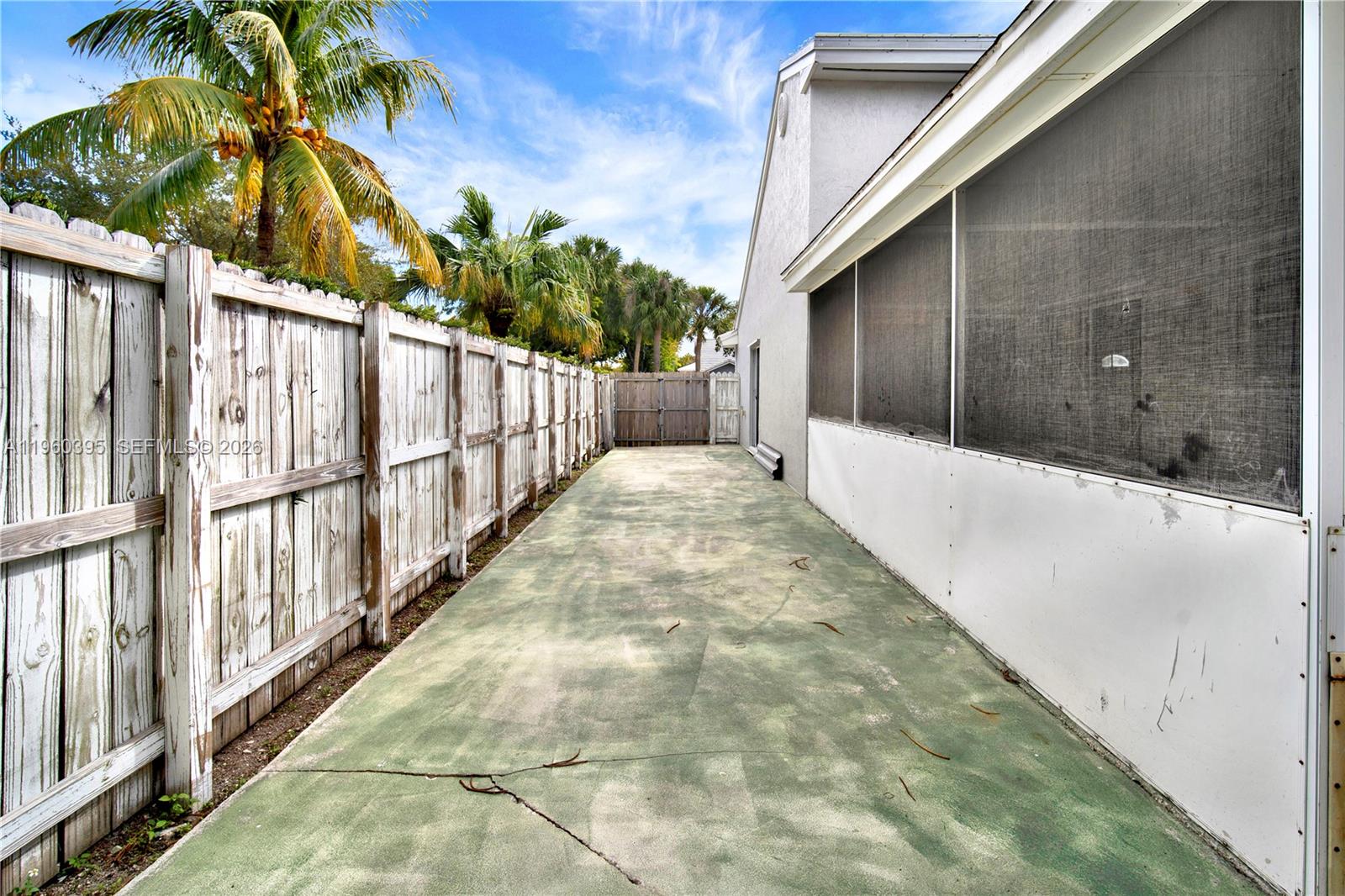 11321 Southwest 62nd Lane Miami, FL 33173 - Photo 29 of 43 a view of a pathway of a building with wooden fence