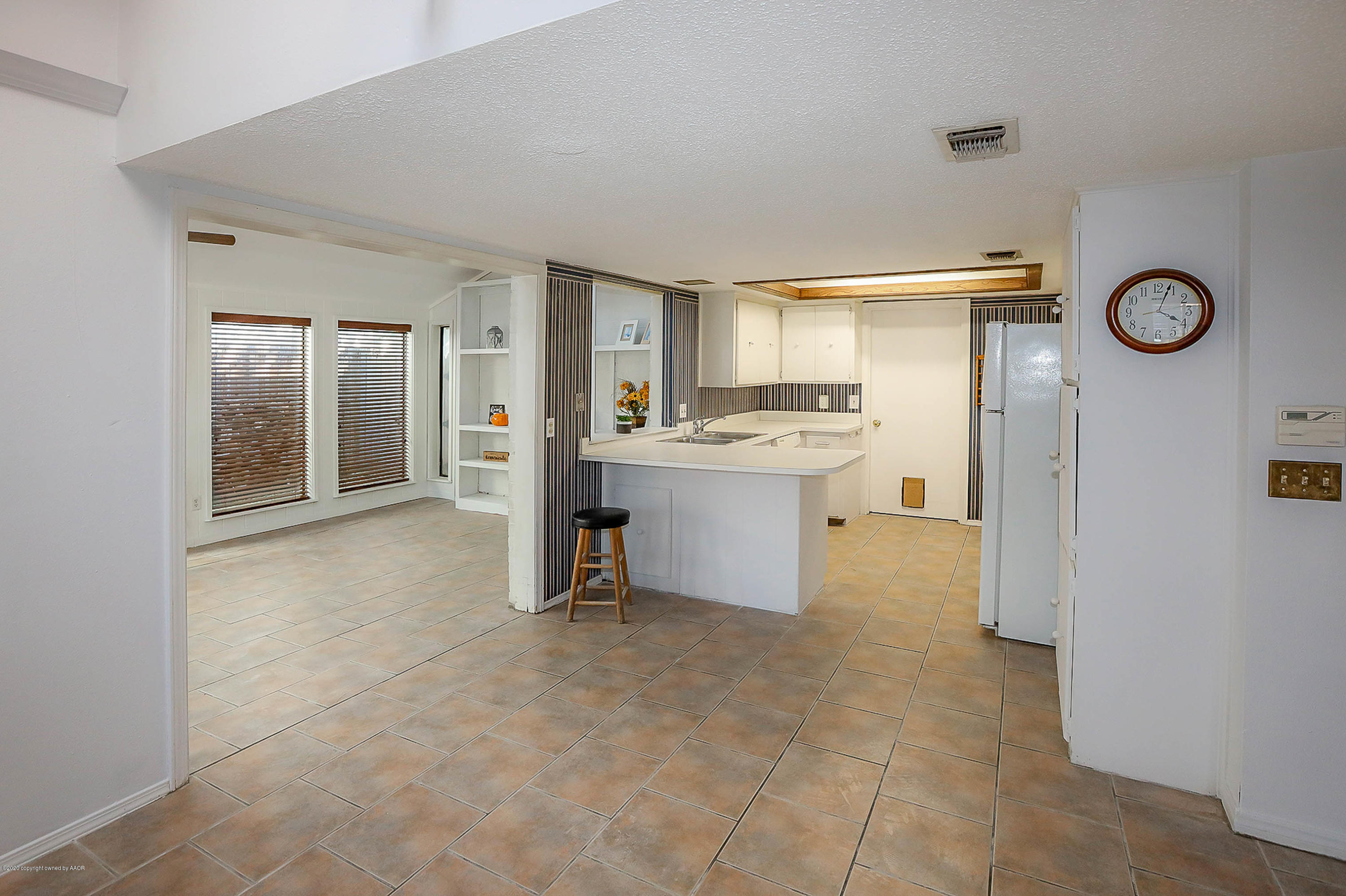 2802 Shield Court Amarillo, TX 79110 - Photo 13 of 32 a view of a kitchen with refrigerator and windows