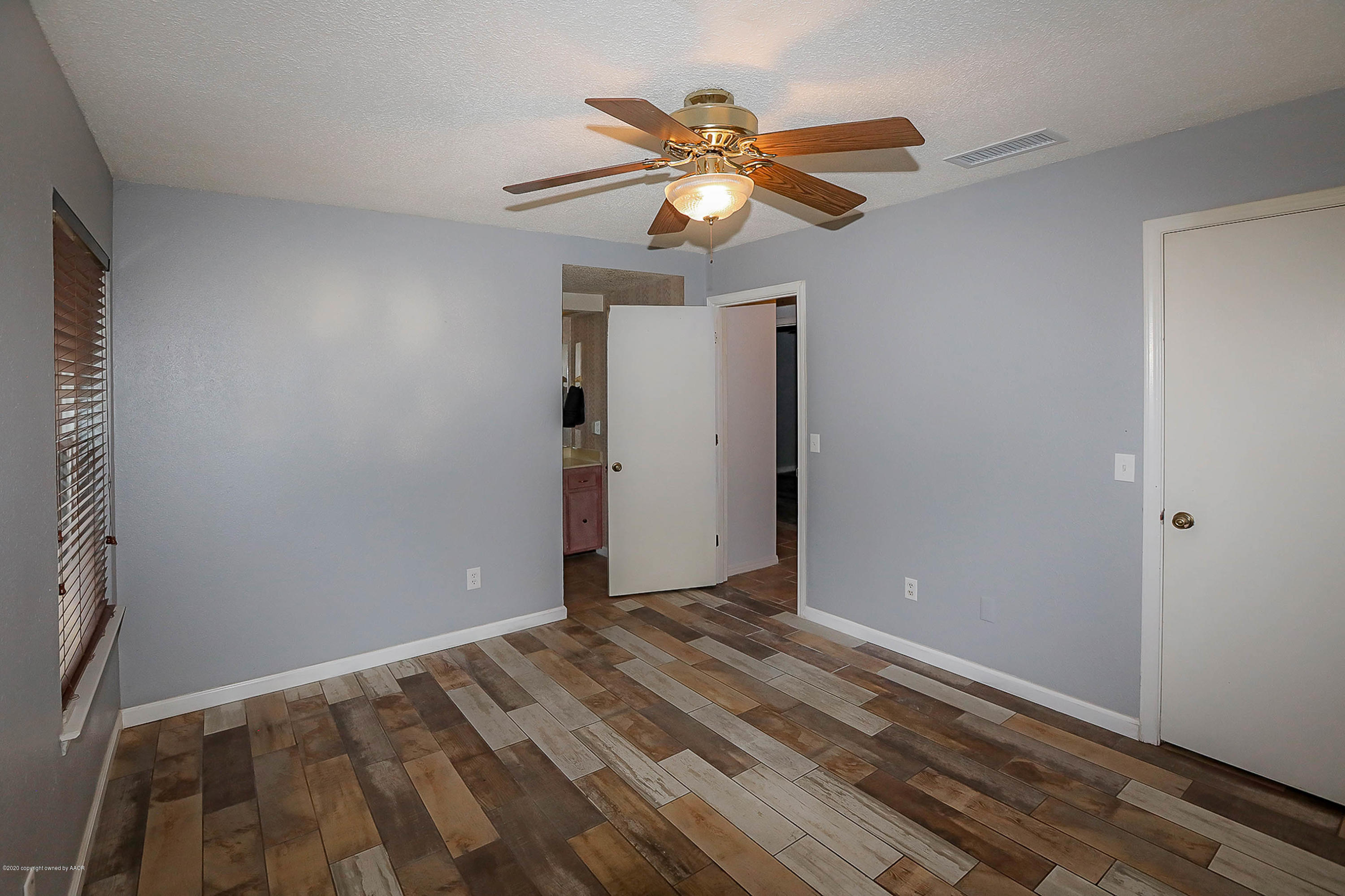 2802 Shield Court Amarillo, TX 79110 - Photo 15 of 32 a view of room with wooden floor