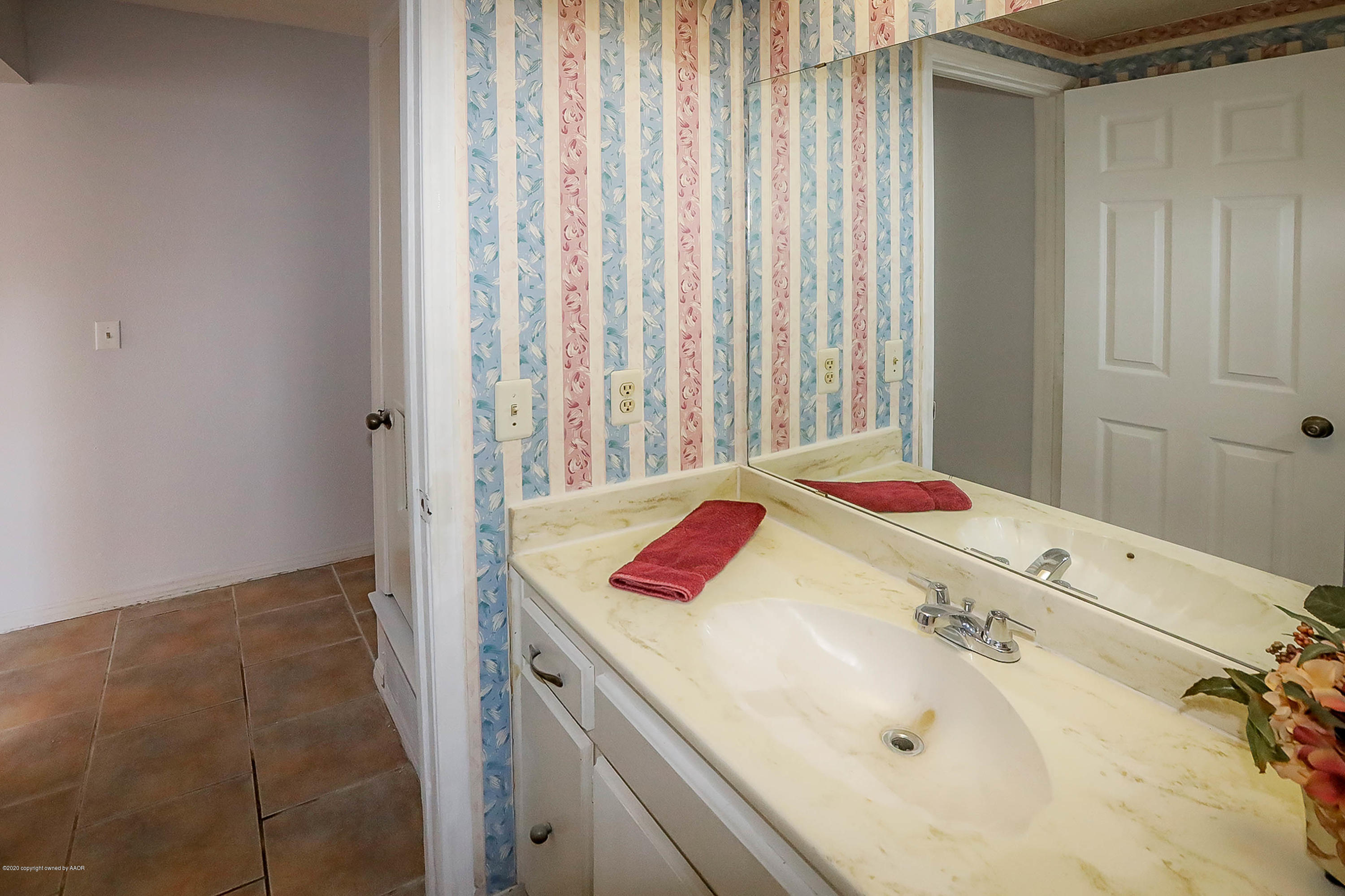 2802 Shield Court Amarillo, TX 79110 - Photo 23 of 32 a bathroom with a tub and shower