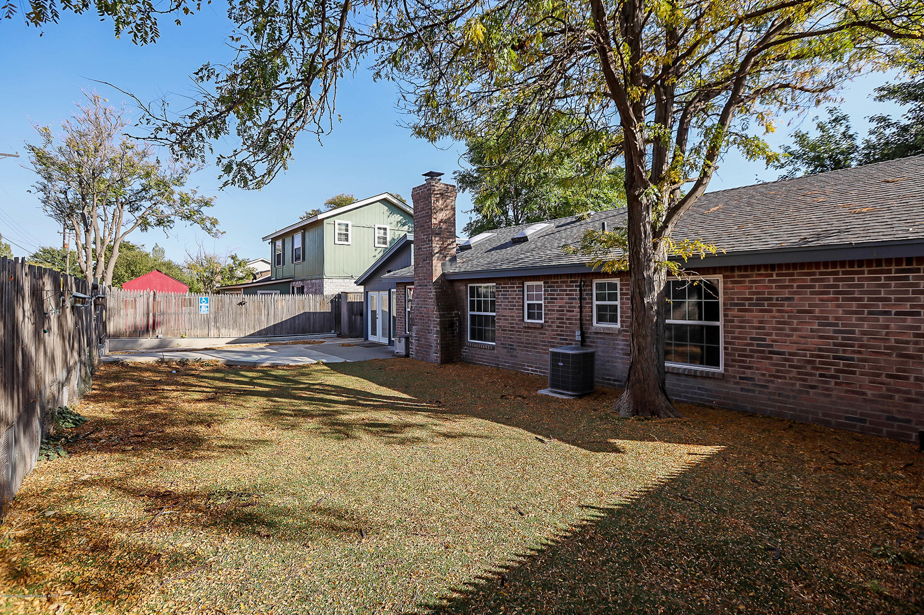 2802 Shield Court Amarillo, TX 79110 - Photo 29 of 32 a front view of a house with a yard and garage