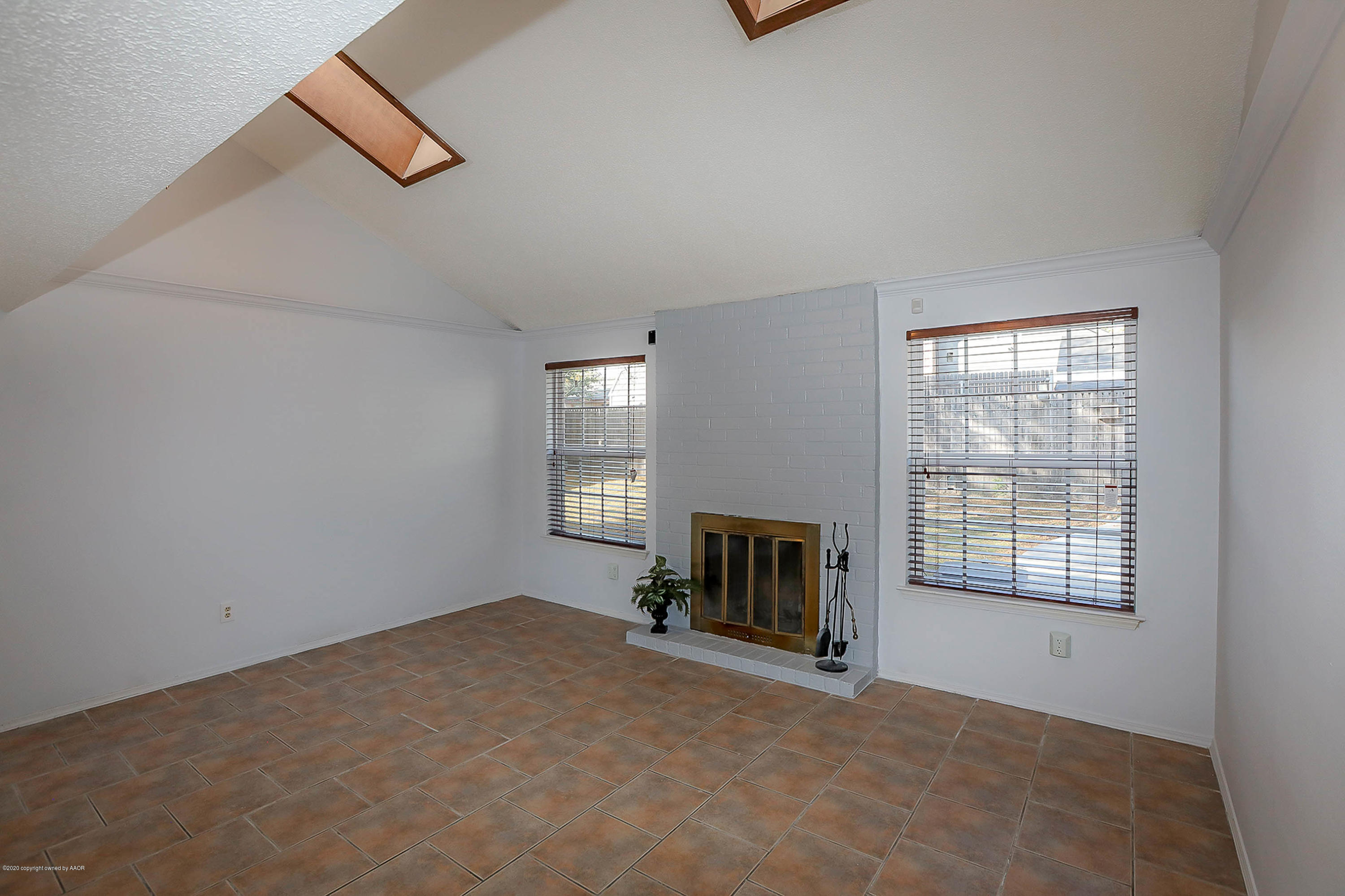 2802 Shield Court Amarillo, TX 79110 - Photo 6 of 32 an empty room with windows and fireplace