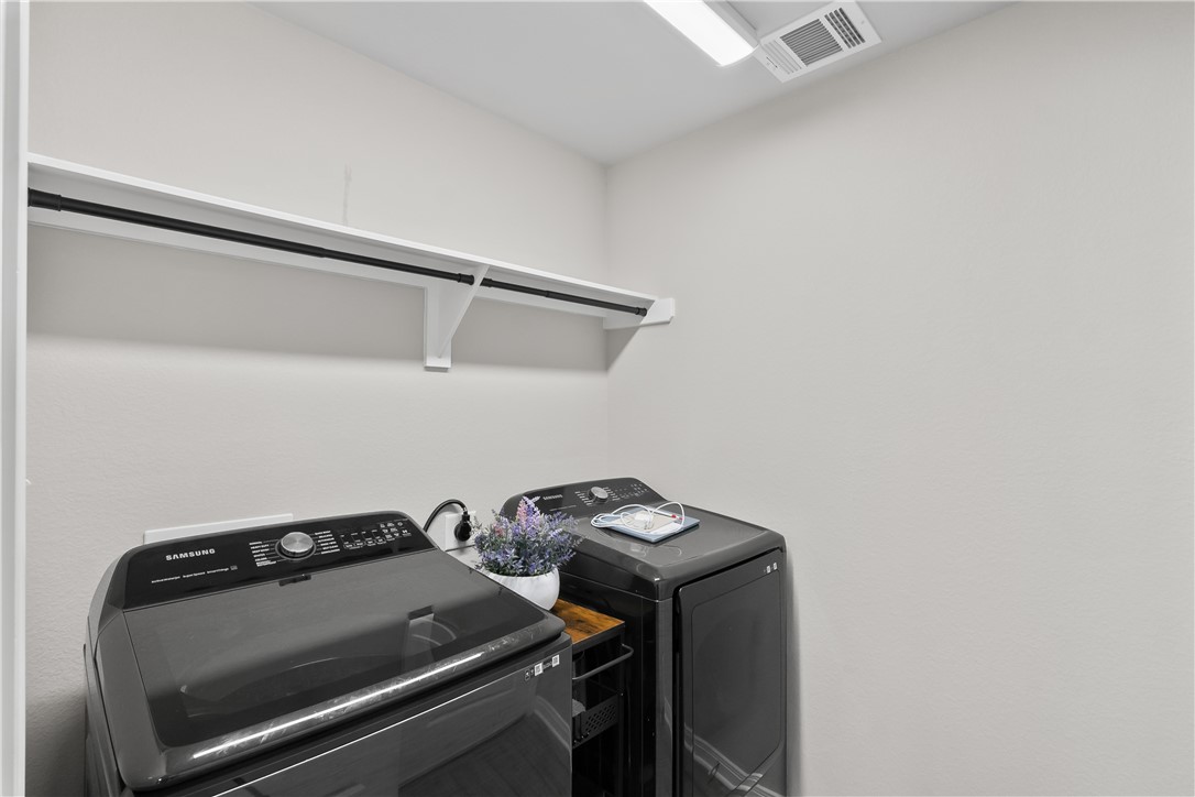 1925 Viva Road Bryan, TX 77807 - Photo 11 of 25 Washroom featuring washing machine and dryer