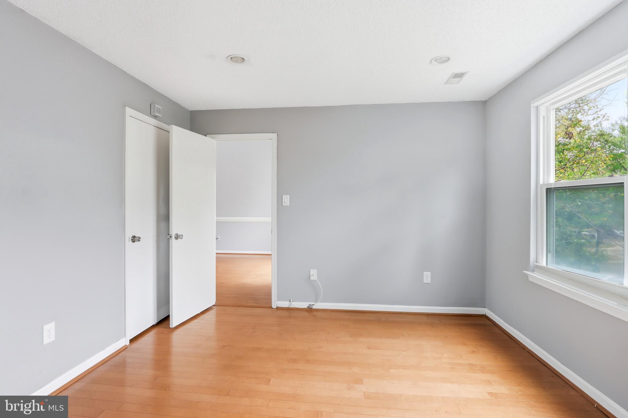 12909 Churchill Ridge Circle, Unit 12 Germantown, MD 20874 - Photo 26 of 44 a view of an empty room with window and closet area