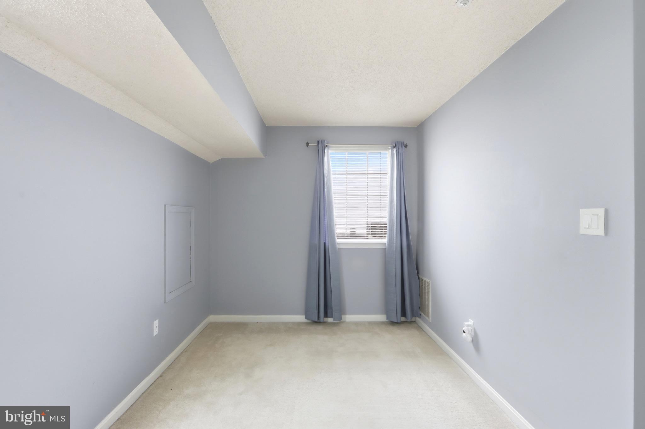 12909 Churchill Ridge Circle, Unit 12 Germantown, MD 20874 - Photo 30 of 44 an empty room with windows