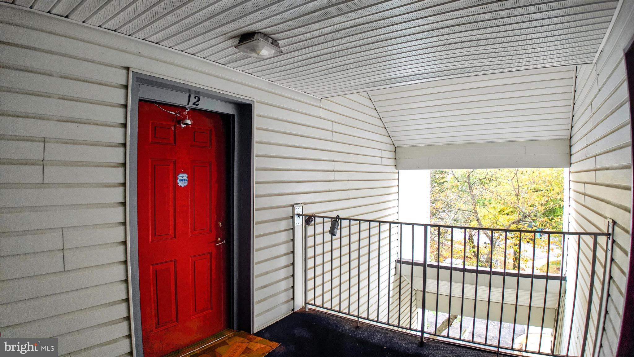12909 Churchill Ridge Circle, Unit 12 Germantown, MD 20874 - Photo 3 of 44 a view of a porch