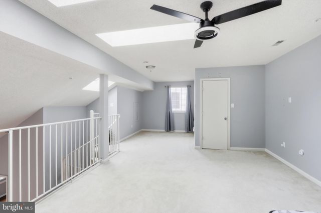 a view of balcony with wooden floor and fence