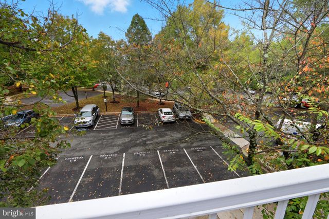 a view of a balcony with wooden floor
