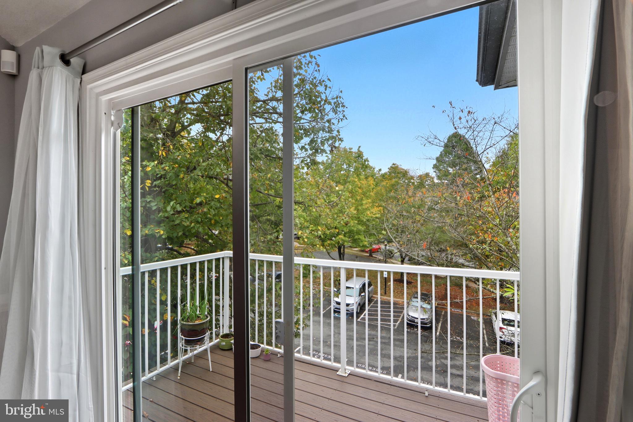 12909 Churchill Ridge Circle, Unit 12 Germantown, MD 20874 - Photo 34 of 44 a view of a balcony with wooden floor