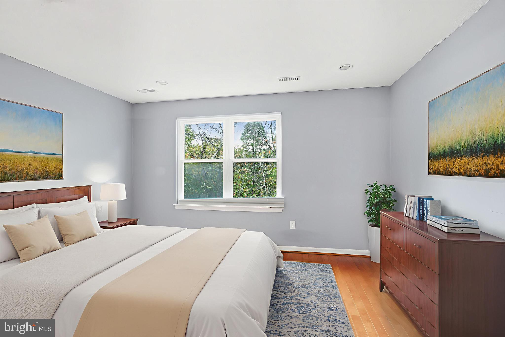 12909 Churchill Ridge Circle, Unit 12 Germantown, MD 20874 - Photo 44 of 44 a bedroom with bed and window