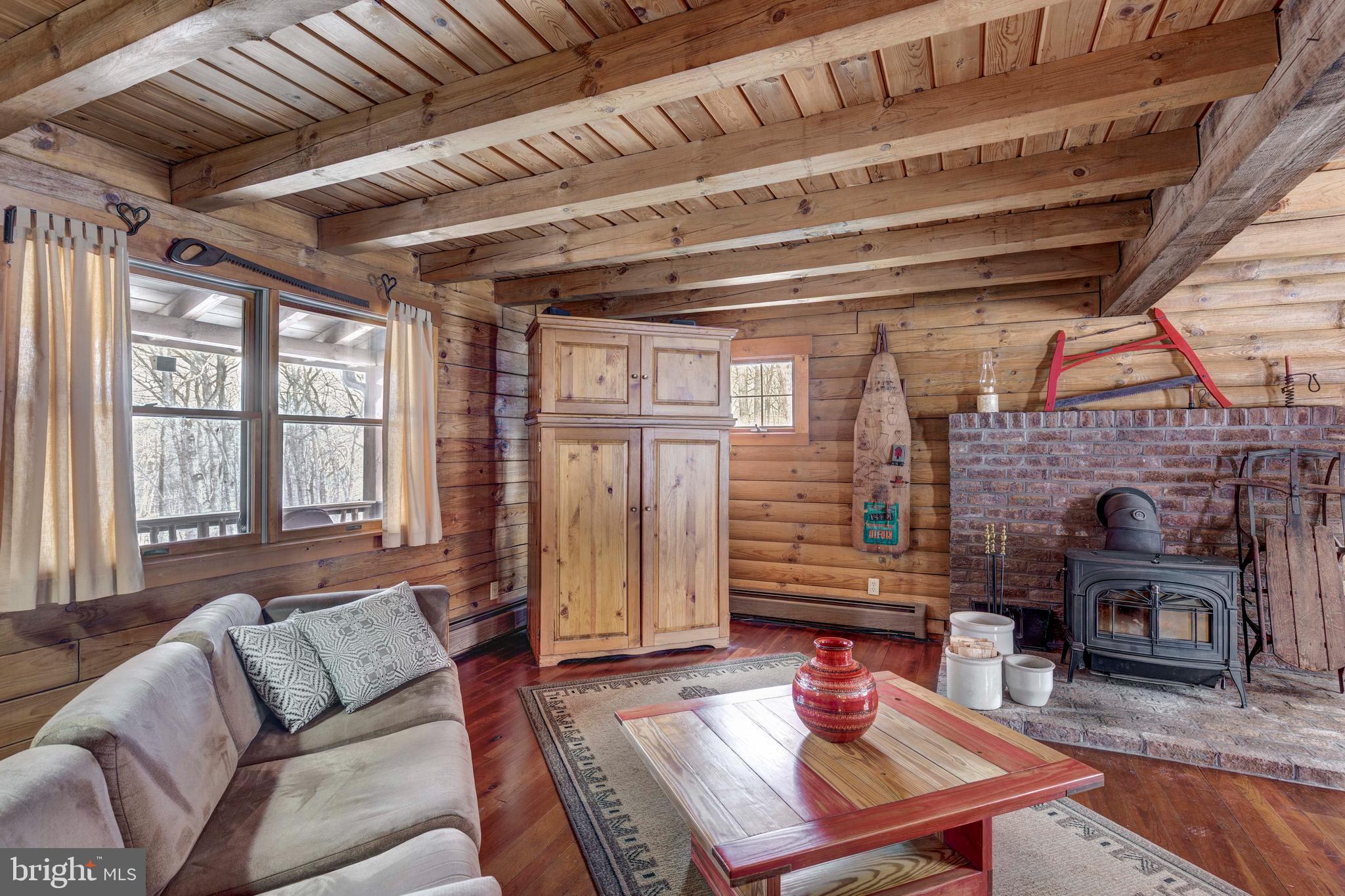 385 Silver Run Valley Road Westminster, MD 21158 - Photo 20 of 59 a living room with furniture and a fireplace