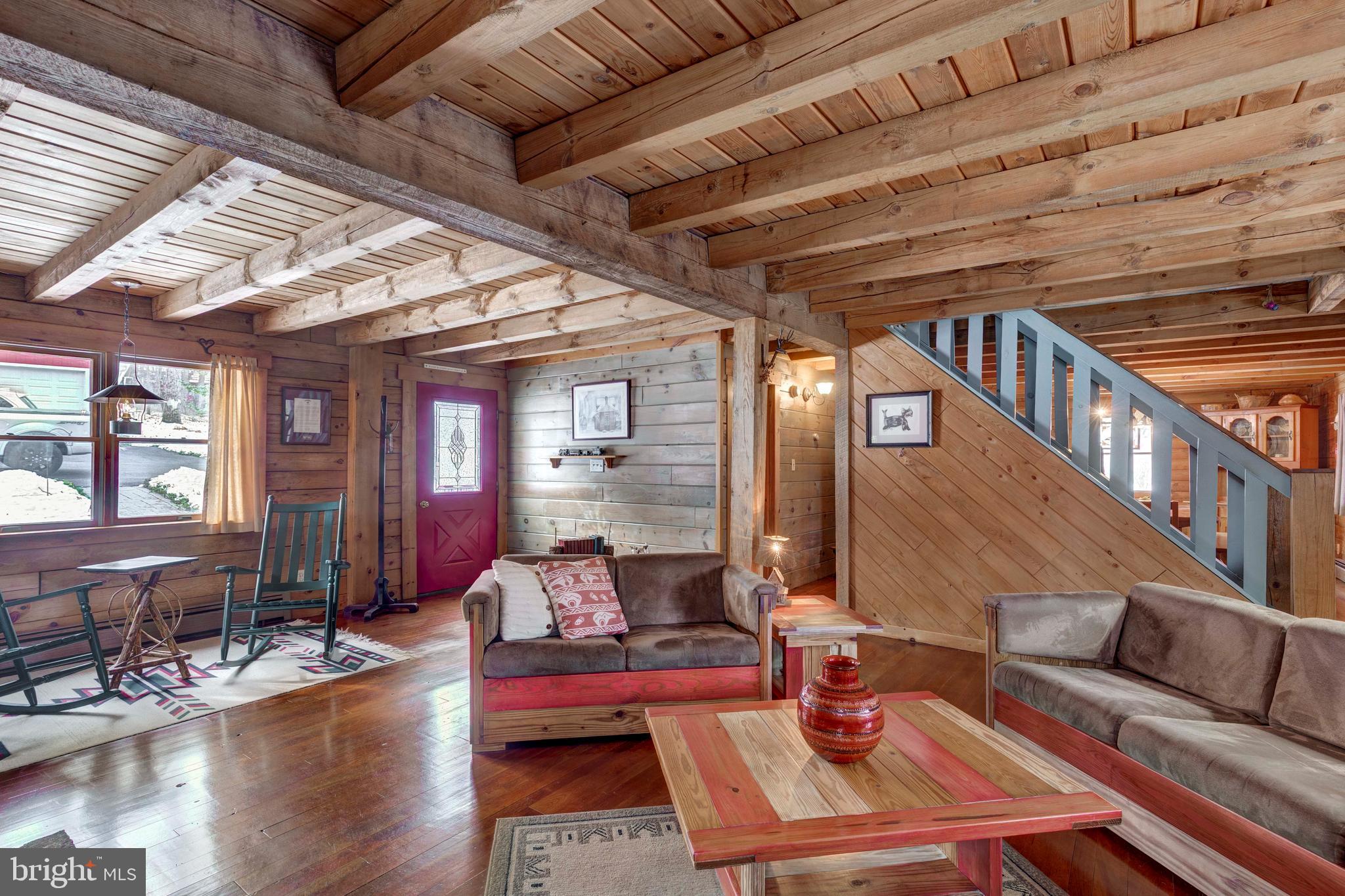385 Silver Run Valley Road Westminster, MD 21158 - Photo 22 of 59 a living room with furniture and wooden floor