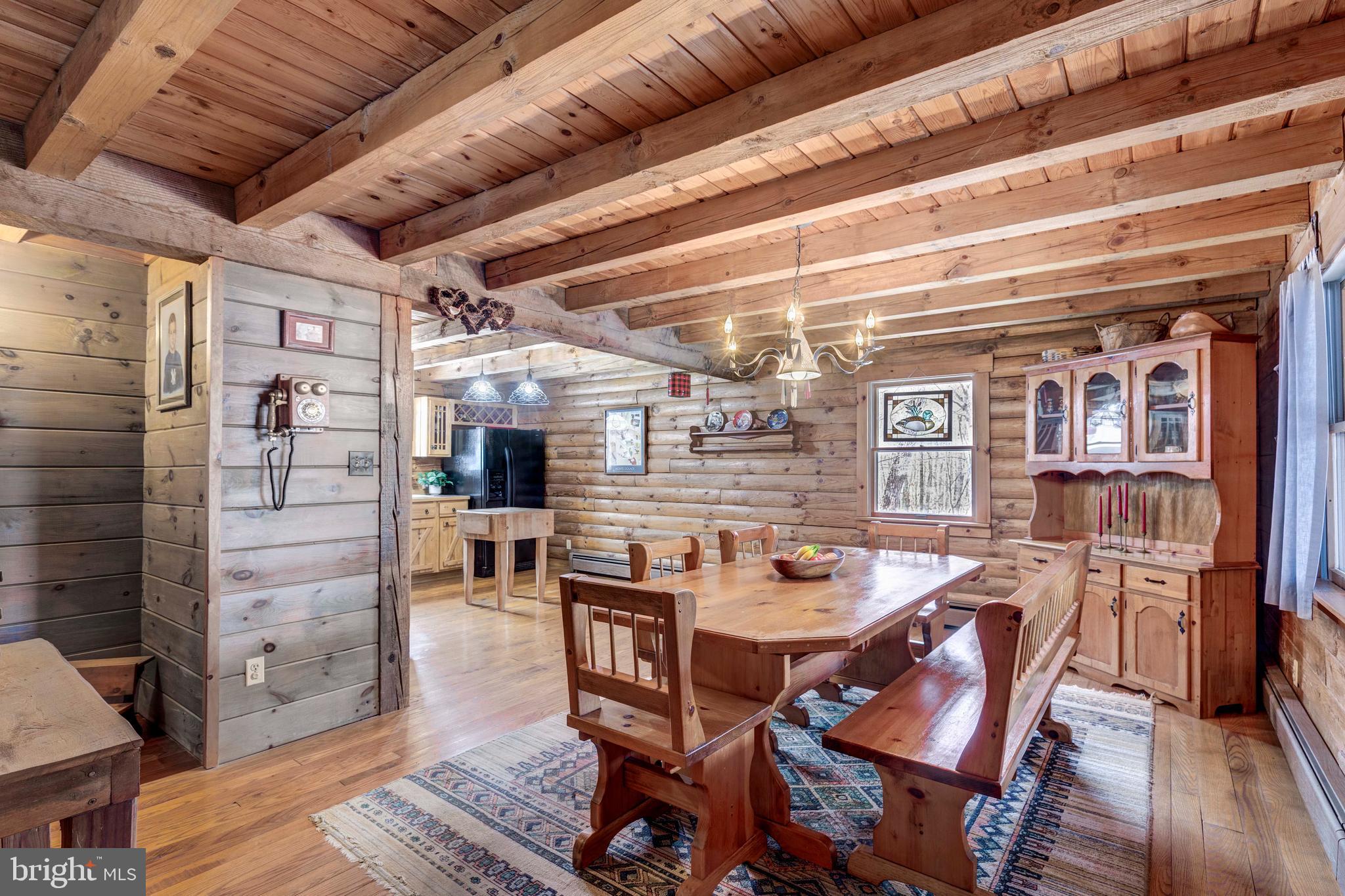 385 Silver Run Valley Road Westminster, MD 21158 - Photo 25 of 59 a dining room with furniture and wooden floor