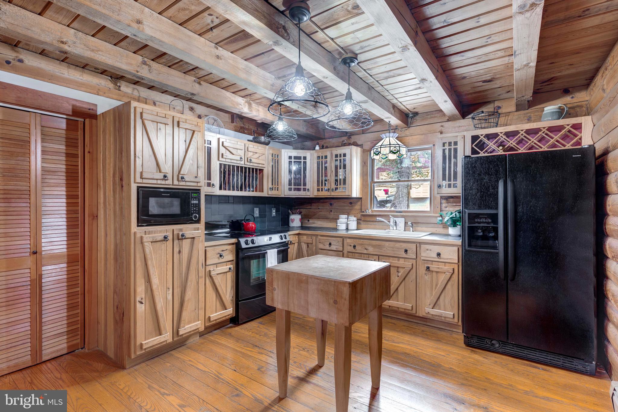 385 Silver Run Valley Road Westminster, MD 21158 - Photo 30 of 59 a kitchen with stainless steel appliances granite countertop a refrigerator and a stove top oven