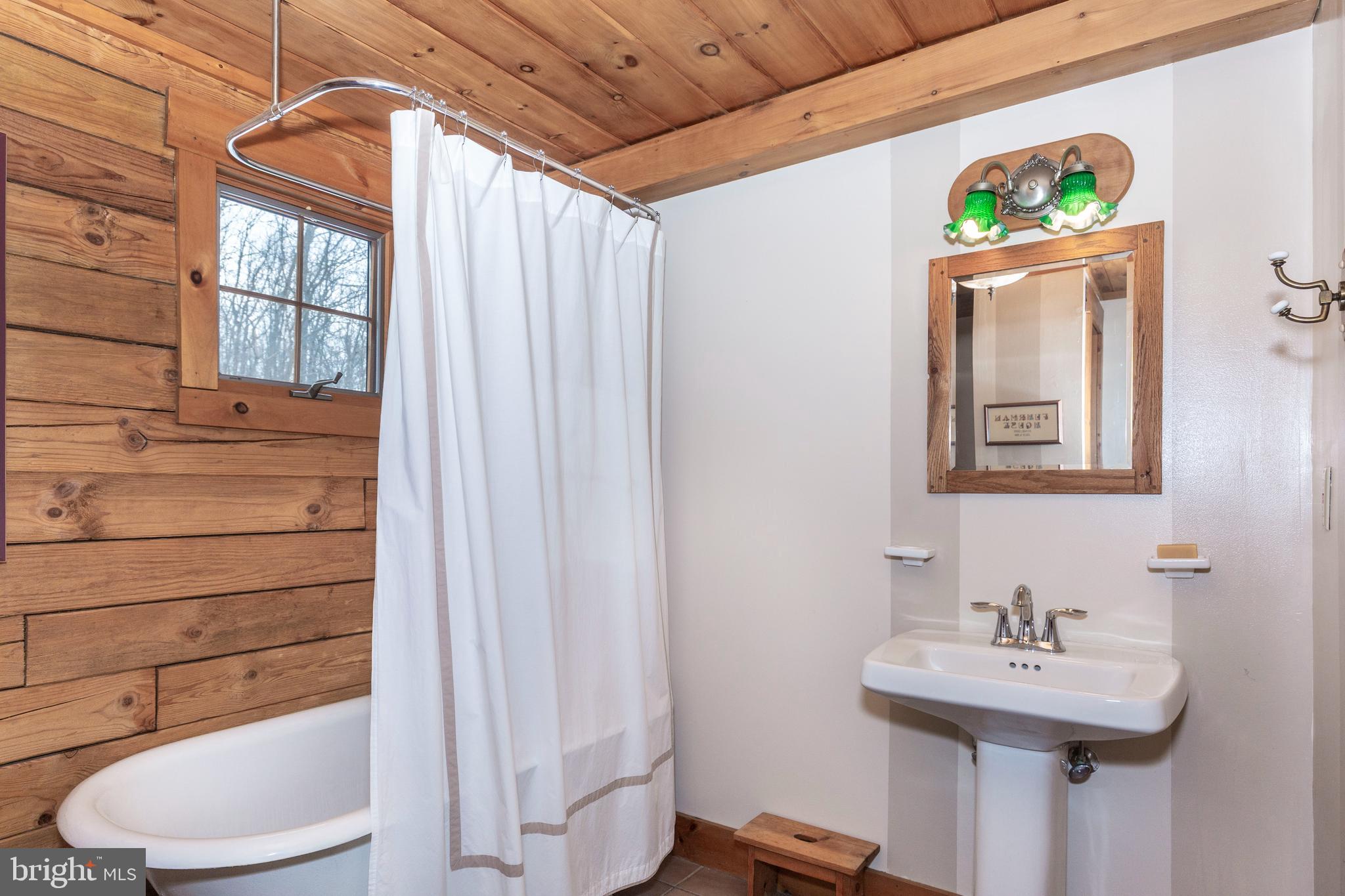 385 Silver Run Valley Road Westminster, MD 21158 - Photo 34 of 59 a bathroom with a sink toilet and mirror