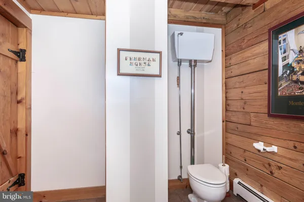 a spacious bedroom with a bed and a view of living room