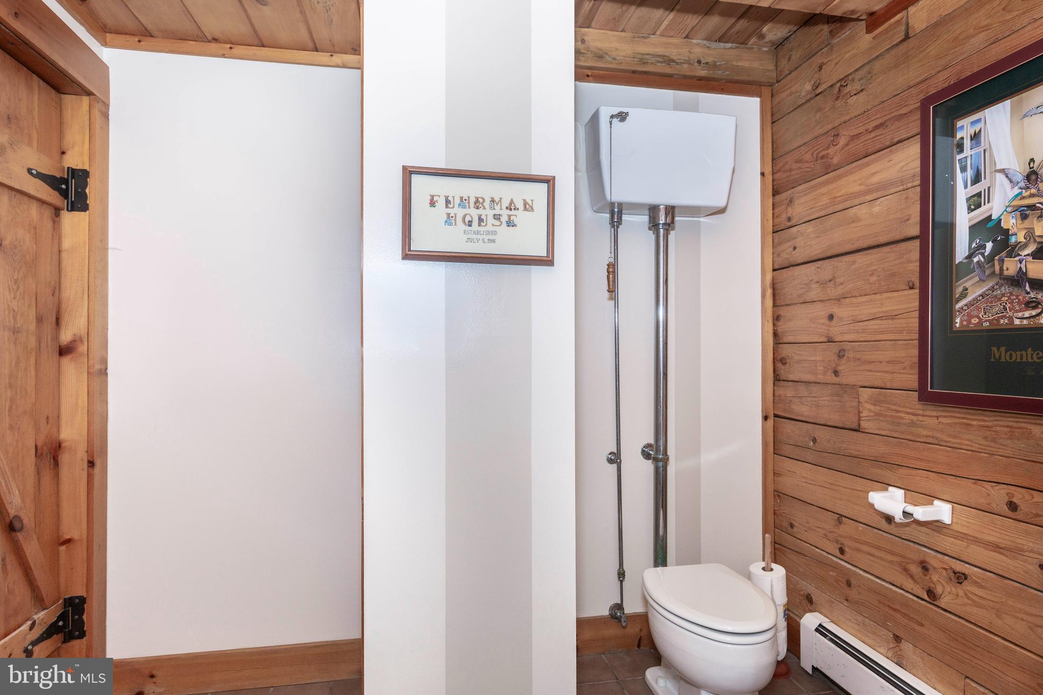 385 Silver Run Valley Road Westminster, MD 21158 - Photo 35 of 59 a bathroom with a toilet sink and shower