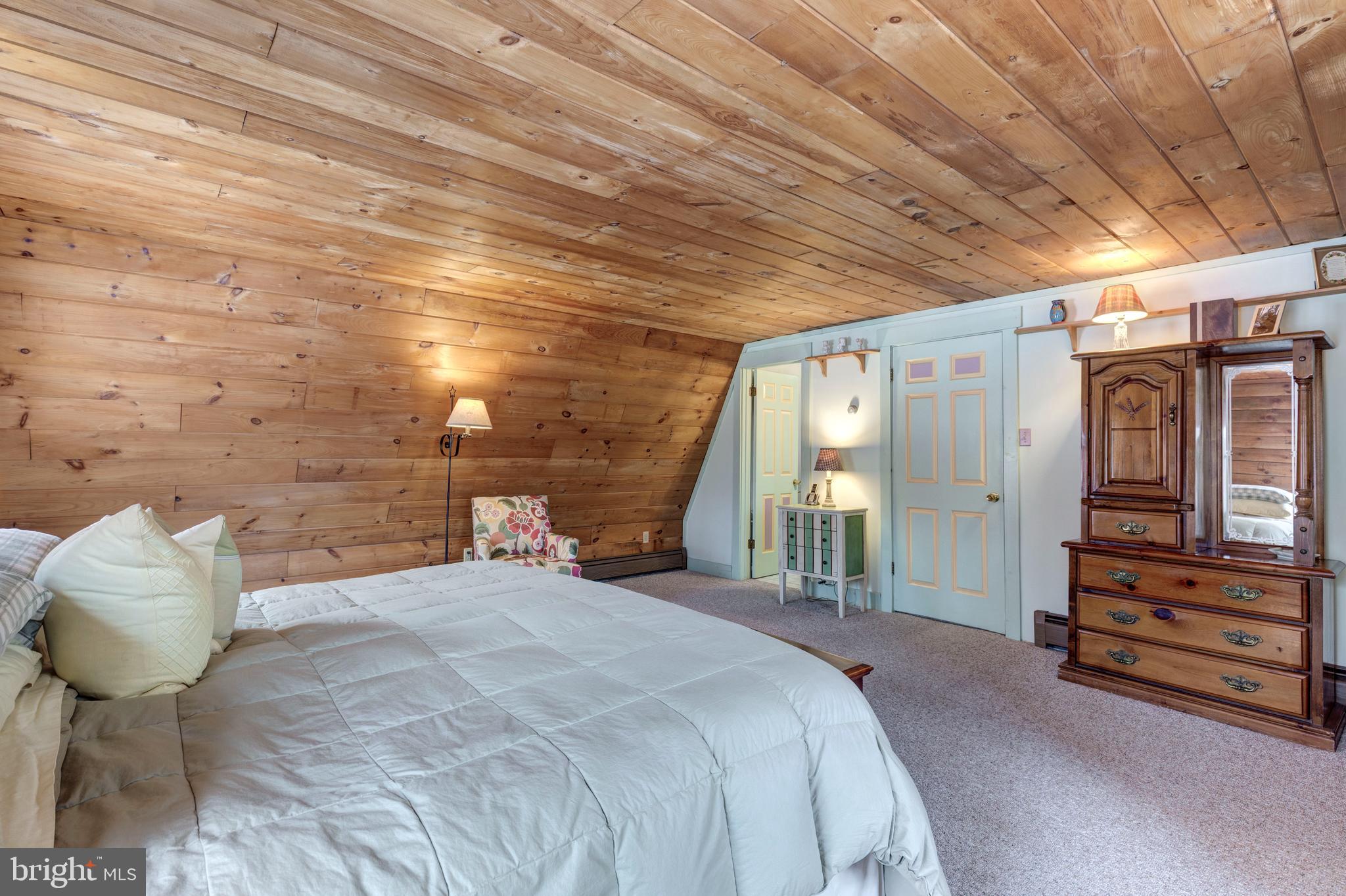 385 Silver Run Valley Road Westminster, MD 21158 - Photo 39 of 59 a bedroom with a bed and a chandelier