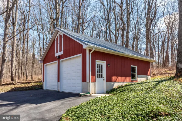 a living room with fireplace furniture and a wooden floor