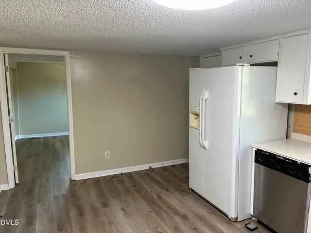 a view of a room with wooden floor and closet