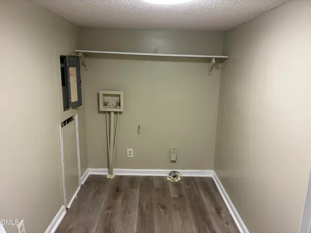 a bathroom with a tub a mirror and a shower