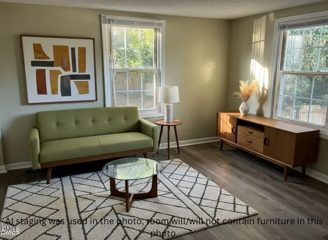 a bedroom with a bed chair and window