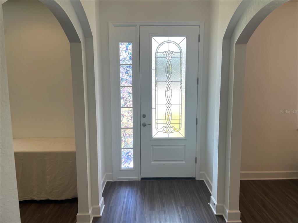 33 Deer Road Frostproof, FL 33843 - Photo 11 of 64 a view of an empty room with wooden floor and a window