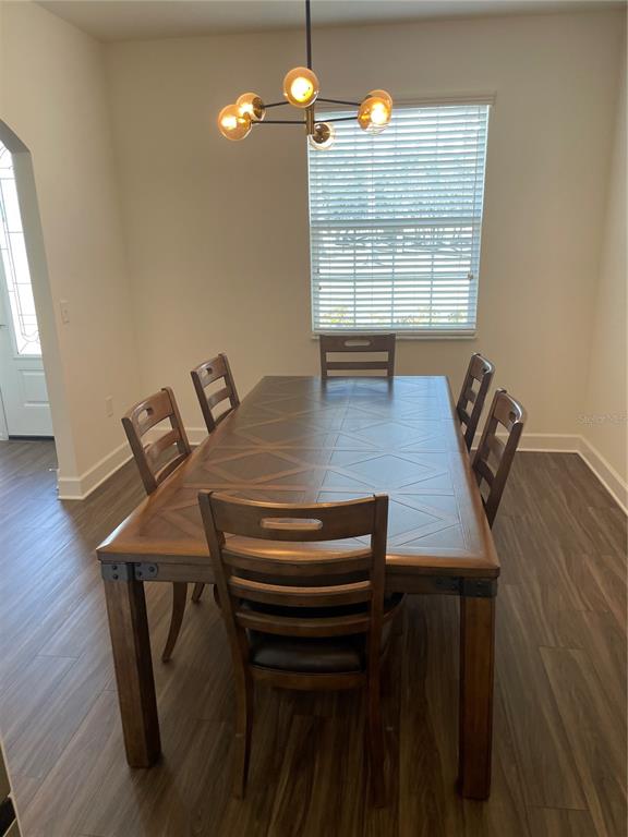 33 Deer Road Frostproof, FL 33843 - Photo 13 of 64 a view of a dining room with furniture window and wooden floor
