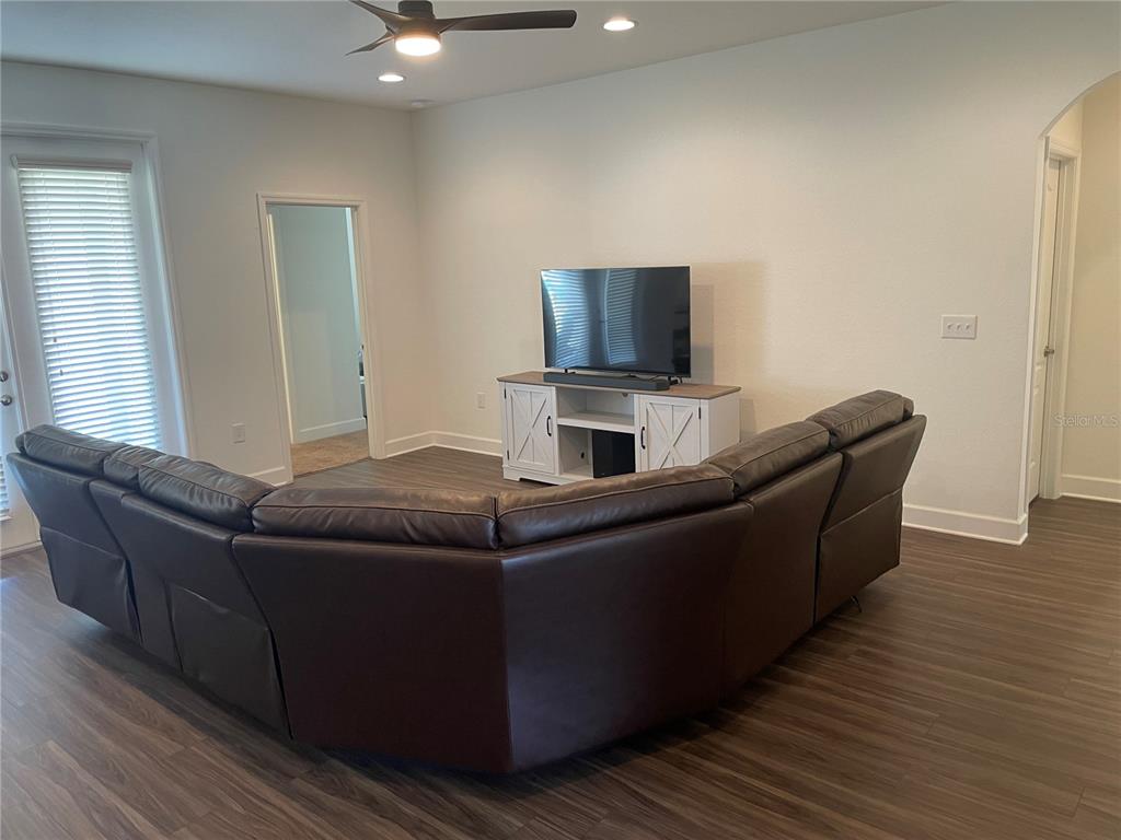 33 Deer Road Frostproof, FL 33843 - Photo 15 of 64 a living room with furniture and a flat screen tv