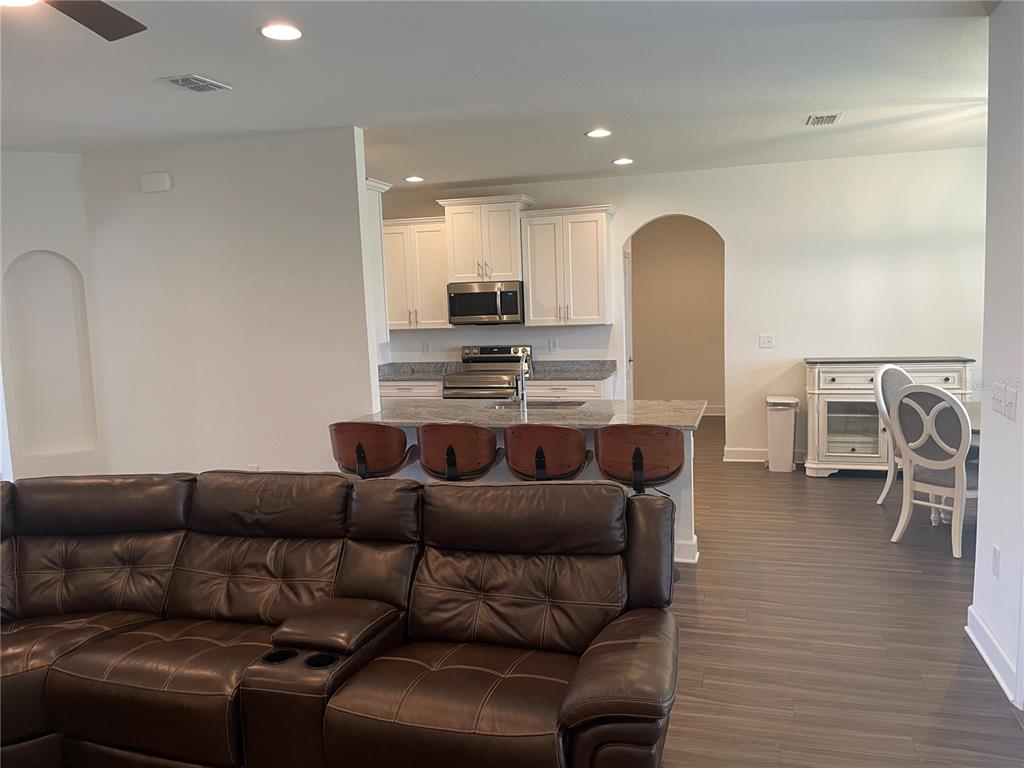 33 Deer Road Frostproof, FL 33843 - Photo 17 of 64 a living room with furniture and kitchen view