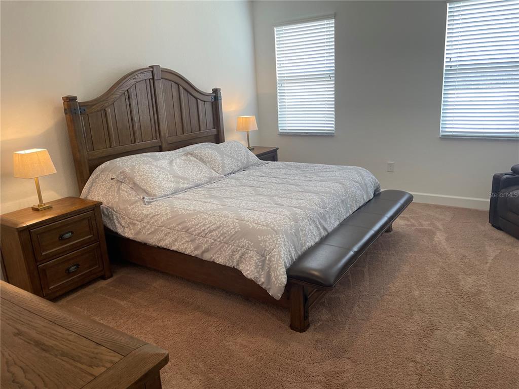 33 Deer Road Frostproof, FL 33843 - Photo 24 of 64 a bed sitting in a bedroom next to a window