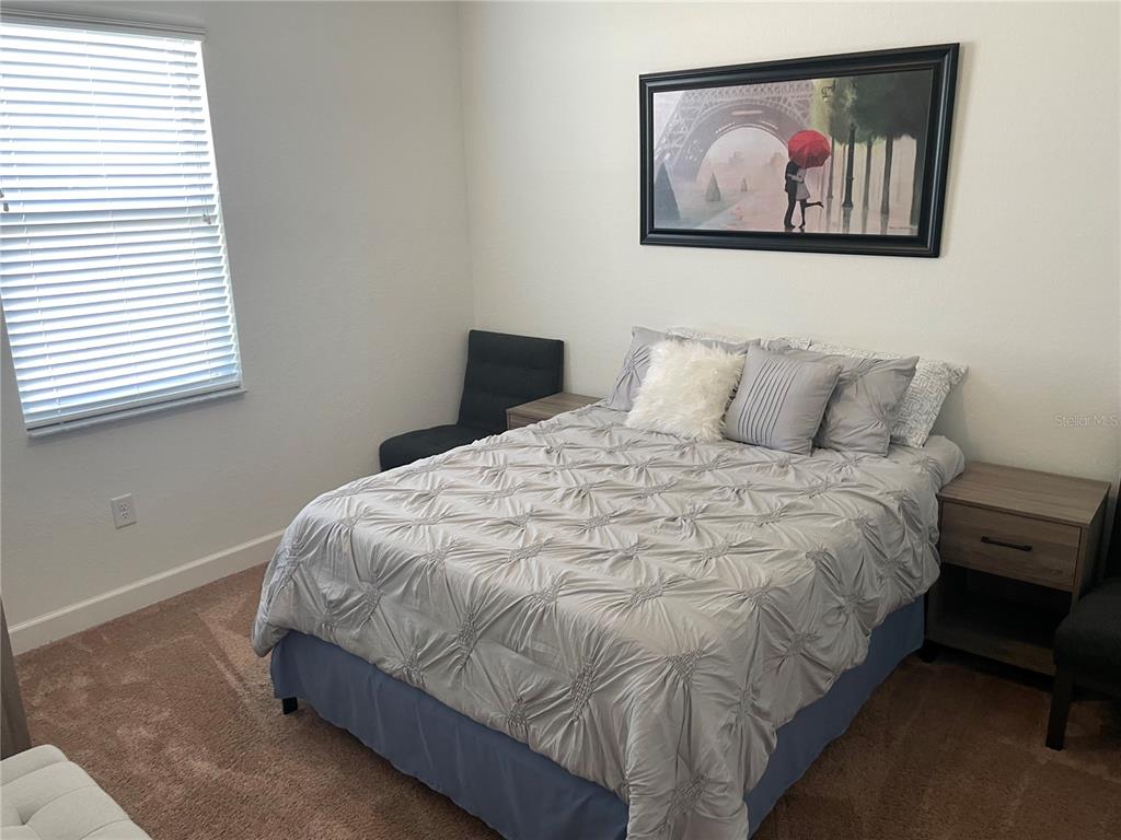 33 Deer Road Frostproof, FL 33843 - Photo 45 of 64 a bedroom with a bed and a painting on the wall