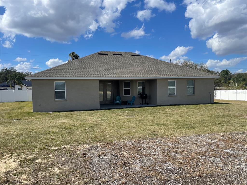 33 Deer Road Frostproof, FL 33843 - Photo 58 of 64 a front view of a house with a garden