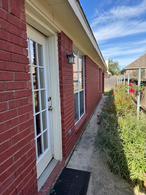 8353 Riversprings Drive Fort Worth, TX 76053 - Photo 17 of 20 View of side of property with brick siding