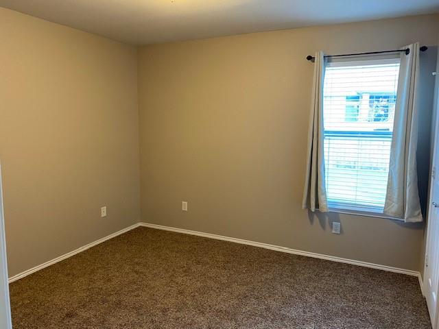 8353 Riversprings Drive Fort Worth, TX 76053 - Photo 3 of 20 Unfurnished room with baseboards and dark carpet