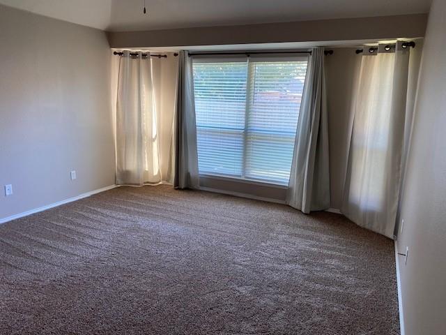 8353 Riversprings Drive Fort Worth, TX 76053 - Photo 5 of 20 Spare room featuring dark colored carpet