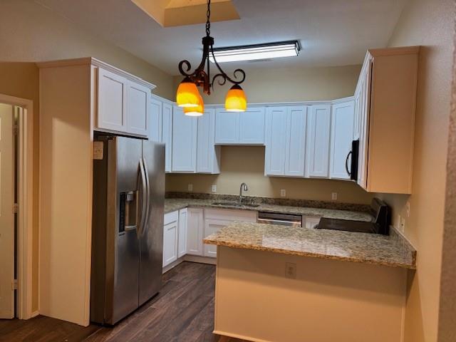 8353 Riversprings Drive Fort Worth, TX 76053 - Photo 7 of 20 Kitchen featuring black appliances, light stone counters, a peninsula, white cabinets, and dark wood-style floors
