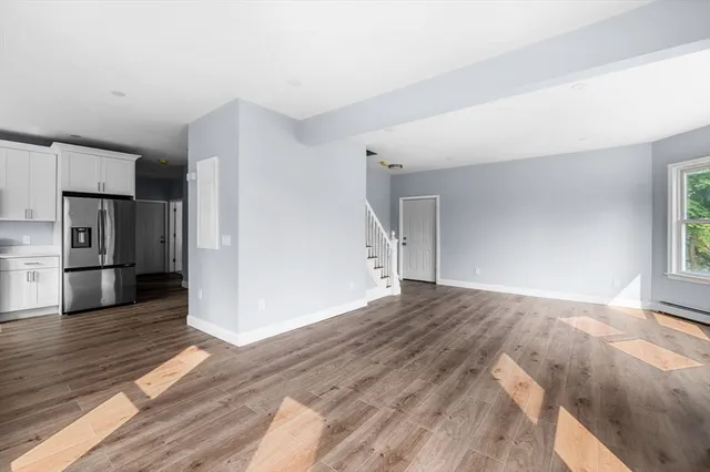 a view of a livingroom with wooden floor