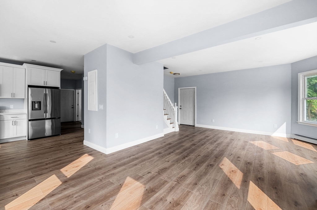 83 Arnold Street Methuen, MA 01844 - Photo 14 of 42 a view of a livingroom with wooden floor